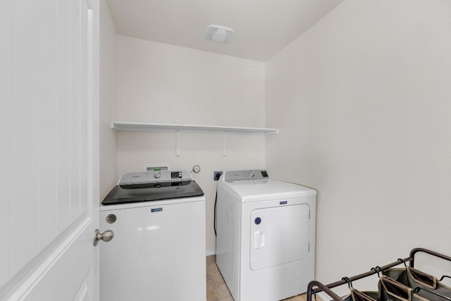 laundry area featuring laundry area and washing machine and clothes dryer