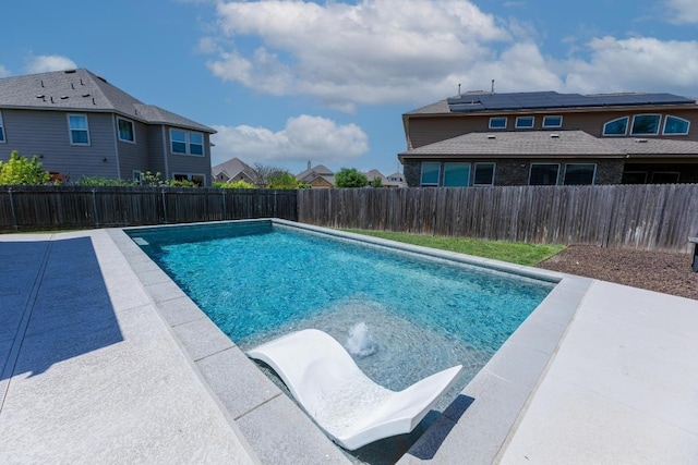 view of pool featuring a fenced in pool, a patio, a residential view, and a fenced backyard