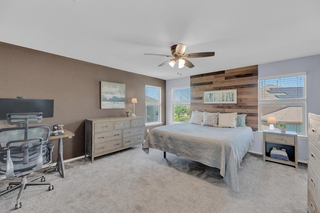 5812 Pescia St, Round Rock, TX 78665 - bedroom with multiple windows, light colored carpet, a desk, and wood walls
