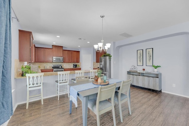 5812 Pescia St, Round Rock, TX 78665 - dining area featuring light wood-style flooring, a chandelier, recessed lighting, and baseboards