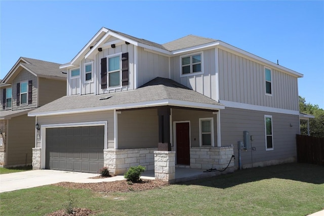 70 Snowy Plover Ln, Leander, TX 78641 - view of front of house with board and batten siding, a garage, a front yard, and driveway