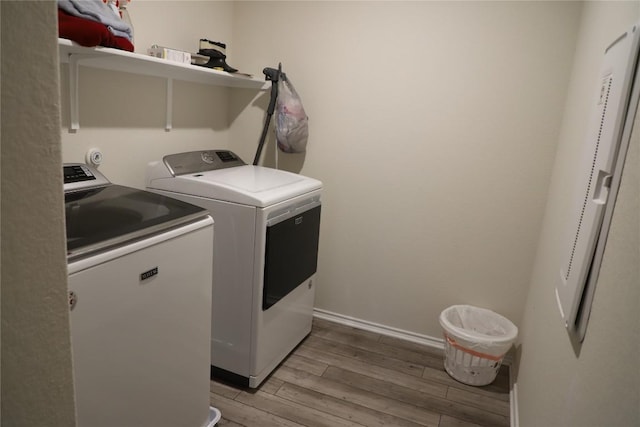 70 Snowy Plover Ln, Leander, TX 78641 - washroom with independent washer and dryer, light wood-type flooring, and baseboards