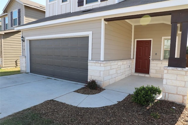 70 Snowy Plover Ln, Leander, TX 78641 - doorway to property with a garage, board and batten siding, and stone siding