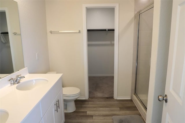 70 Snowy Plover Ln, Leander, TX 78641 - full bath with a spacious closet, wood finished floors, toilet, and double vanity