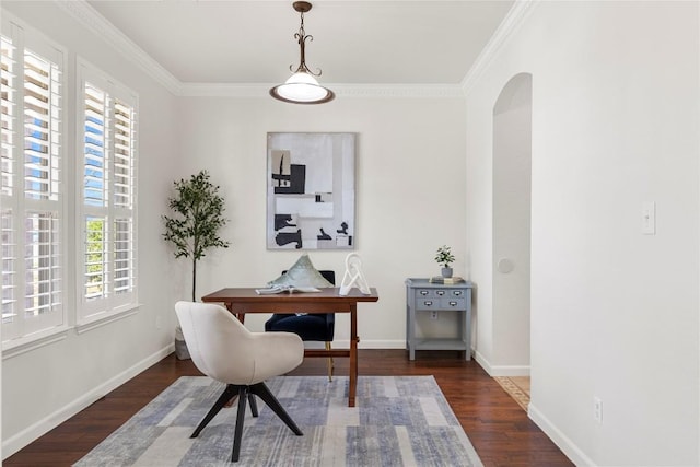 office space with arched walkways, baseboards, ornamental molding, and wood finished floors