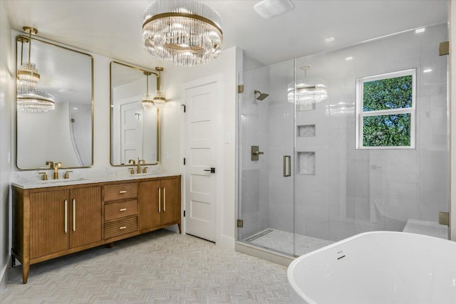 6304 Lost Horizon Dr, Austin, TX 78759 - bathroom with a chandelier, a shower stall, a freestanding bath, and double vanity