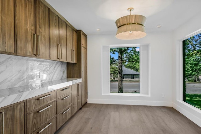 6304 Lost Horizon Dr, Austin, TX 78759 - kitchen featuring healthy amount of natural light, baseboards, and light wood-style flooring