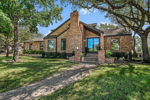 6304 Lost Horizon Dr, Austin, TX 78759 - tudor house with brick siding, a front lawn, and a chimney