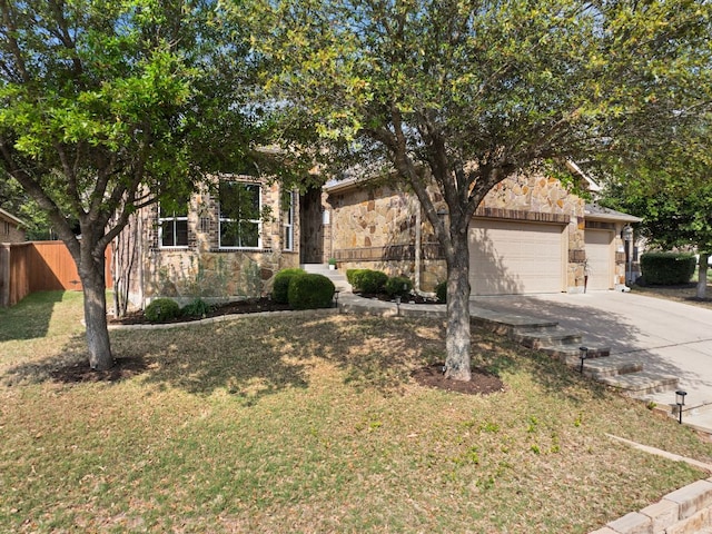 215 Choke Canyon Ln, Georgetown, TX 78628 - obstructed view of property featuring stone siding, driveway, and an attached garage