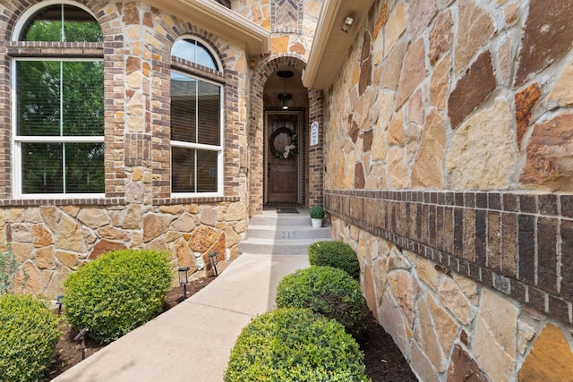 215 Choke Canyon Ln, Georgetown, TX 78628 - view of exterior entry with stone siding and brick siding