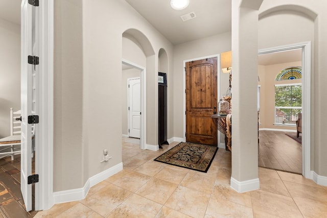 215 Choke Canyon Ln, Georgetown, TX 78628 - entrance foyer with arched walkways and light tile patterned floors