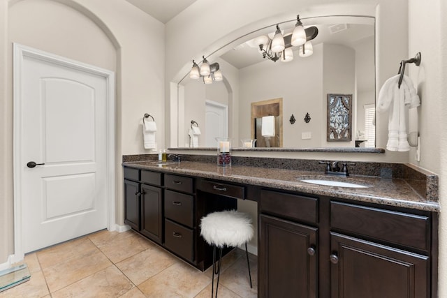 215 Choke Canyon Ln, Georgetown, TX 78628 - full bath with double vanity, a chandelier, and tile patterned floors