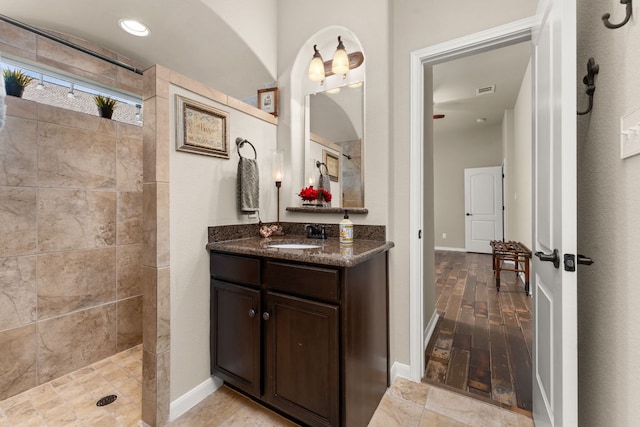 215 Choke Canyon Ln, Georgetown, TX 78628 - full bath featuring walk in shower, vanity, and wood finished floors
