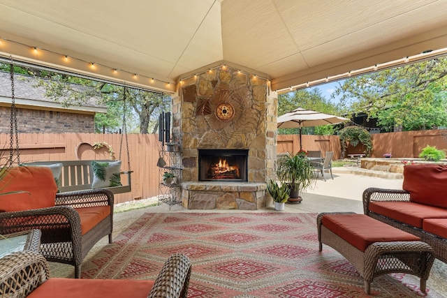 215 Choke Canyon Ln, Georgetown, TX 78628 - fenced backyard with a patio area and an outdoor living space with a fireplace