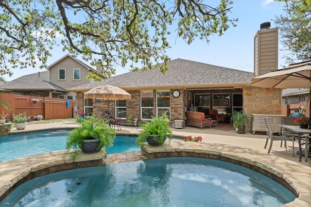 215 Choke Canyon Ln, Georgetown, TX 78628 - view of swimming pool with an in-ground hot tub, a patio area, and outdoor lounge area