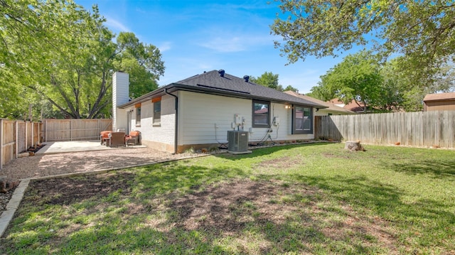 812 Saunders Dr, Round Rock, TX 78664 - back of house featuring a chimney, a patio area, a fenced backyard, and brick siding
