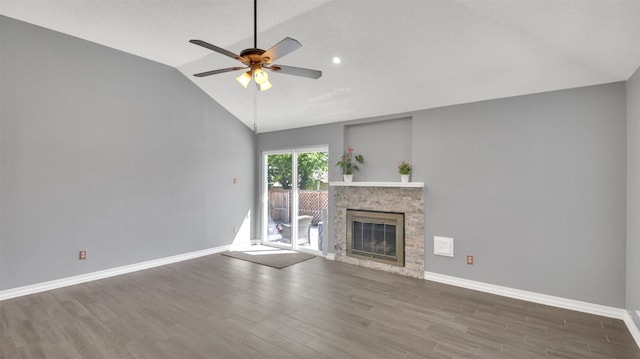 812 Saunders Dr, Round Rock, TX 78664 - unfurnished living room with lofted ceiling, a ceiling fan, wood finished floors, a glass covered fireplace, and recessed lighting