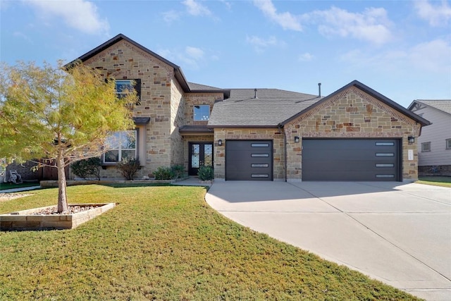 french country home with a front lawn, stone siding, a garage, and concrete driveway
