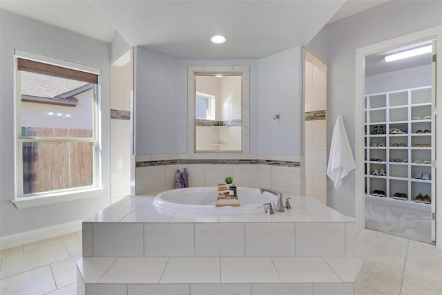 bathroom featuring a bath and tile patterned flooring