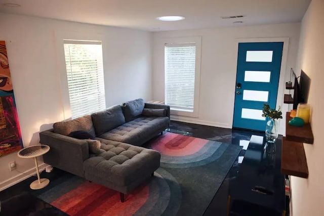 living area featuring visible vents and baseboards