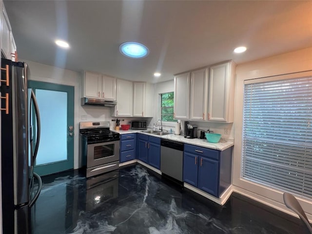 kitchen featuring a sink, under cabinet range hood, white cabinetry, stainless steel appliances, and blue cabinets