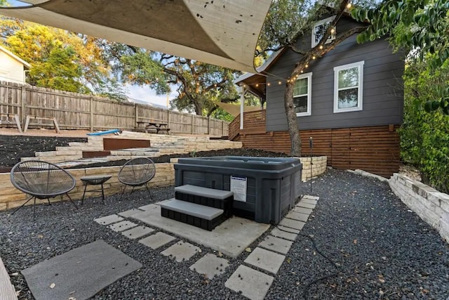 403 W Mary St, Austin, TX 78704 - fenced backyard featuring a hot tub, an outdoor fire pit, and a patio