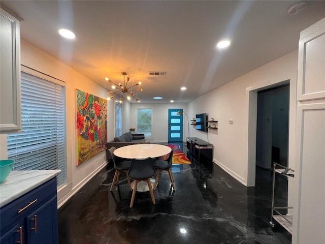 dining area with an inviting chandelier, baseboards, visible vents, and recessed lighting