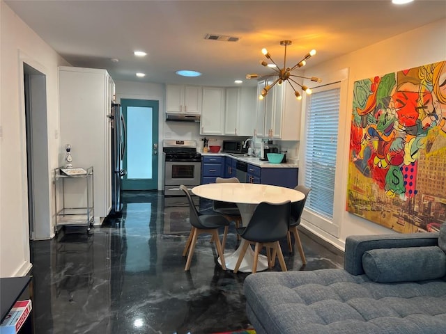 kitchen with visible vents, a chandelier, under cabinet range hood, white cabinetry, and stainless steel appliances