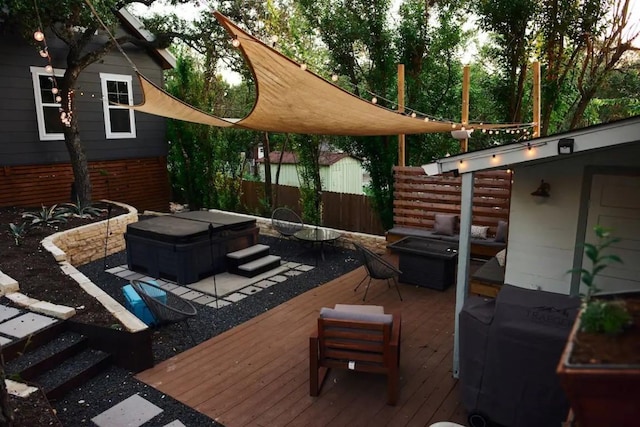 wooden deck with a hot tub