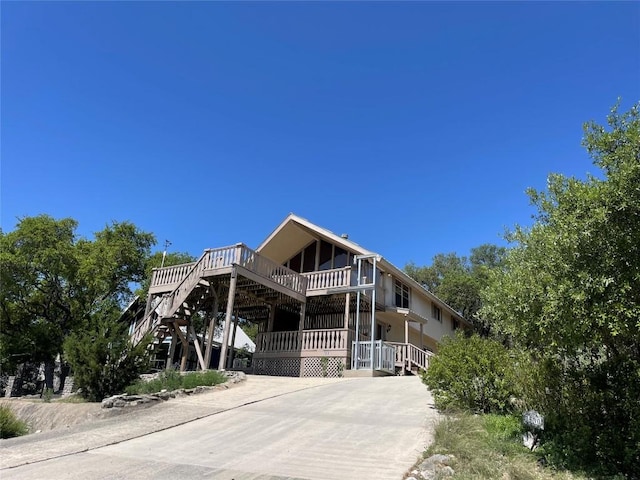 1530 Trailridge Dr, Canyon Lake, TX 78133 - view of front facade featuring concrete driveway and stairs