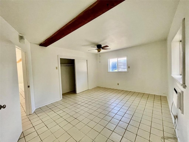 1530 Trailridge Dr, Canyon Lake, TX 78133 - unfurnished bedroom featuring beamed ceiling, light tile patterned floors, a closet, and ceiling fan