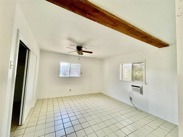 1530 Trailridge Dr, Canyon Lake, TX 78133 - spare room featuring light tile patterned flooring, a ceiling fan, and a wall unit AC