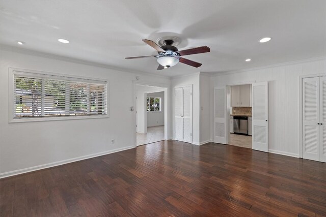1905 Robinhood Trl, Austin, TX 78703 - unfurnished living room featuring crown molding, a ceiling fan, wood finished floors, and recessed lighting