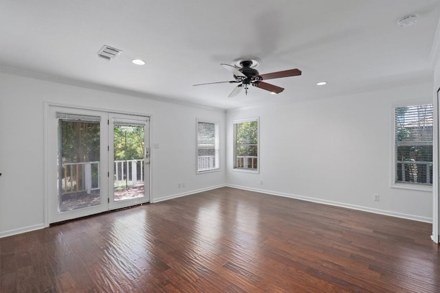 1905 Robinhood Trl, Austin, TX 78703 - spare room featuring plenty of natural light, ceiling fan, a smoke detector, dark wood-style floors, and recessed lighting