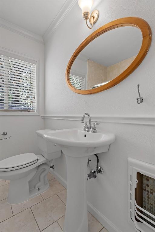 1905 Robinhood Trl, Austin, TX 78703 - half bathroom featuring crown molding and tile patterned flooring