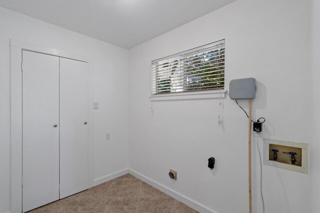 1905 Robinhood Trl, Austin, TX 78703 - laundry room with hookup for a washing machine and light tile patterned floors