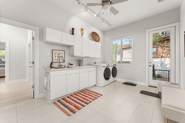 laundry room featuring cabinet space, a sink, separate washer and dryer, rail lighting, and a ceiling fan