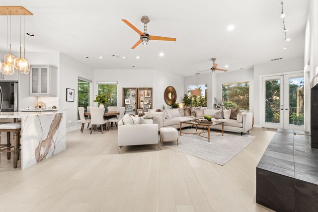 living room featuring ceiling fan, french doors, light wood-style flooring, recessed lighting, and visible vents