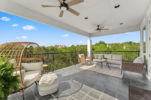 view of patio / terrace with a ceiling fan, a balcony, and an outdoor hangout area