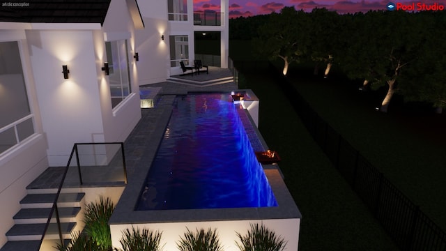 view of swimming pool featuring an infinity pool and a patio
