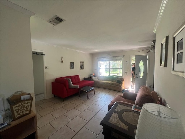 5202 Beechmoor Dr, Austin, TX 78723 - living room featuring crown molding, ceiling fan, visible vents, and light tile patterned floors