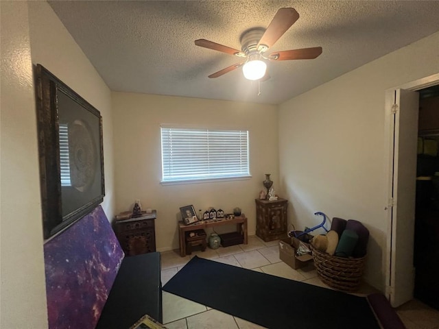 5202 Beechmoor Dr, Austin, TX 78723 - living area featuring light tile patterned floors, a ceiling fan, and a textured ceiling