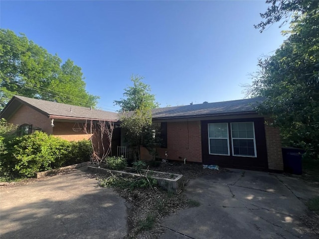5202 Beechmoor Dr, Austin, TX 78723 - single story home featuring brick siding and a patio area