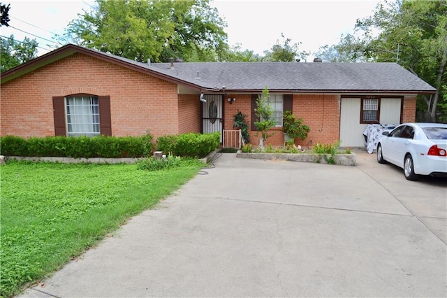 5202 Beechmoor Dr, Austin, TX 78723 - single story home featuring brick siding, a shingled roof, a front yard, and concrete driveway