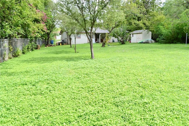 5202 Beechmoor Dr, Austin, TX 78723 - view of yard featuring fence, a storage unit, and an outdoor structure