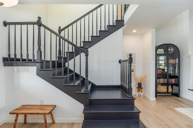 290 County Road 207, Liberty Hill, TX 78642 - stairway with wood finished floors, baseboards, and recessed lighting