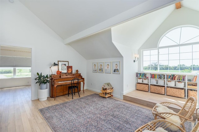 290 County Road 207, Liberty Hill, TX 78642 - sitting room featuring wood finished floors, beamed ceiling, baseboards, and high vaulted ceiling