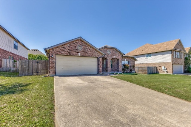 view of front facade with driveway, a front yard, brick siding, a garage, and fence