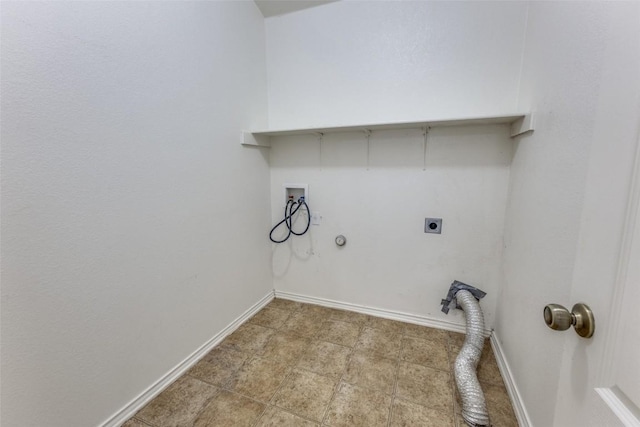 clothes washing area with baseboards, laundry area, gas dryer hookup, hookup for an electric dryer, and hookup for a washing machine