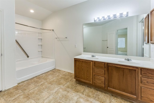 full bathroom featuring shower / bath combination, double vanity, and a sink